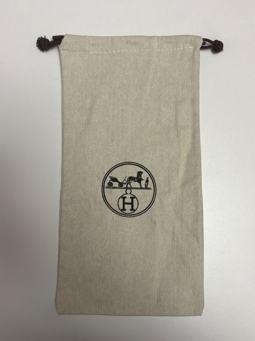 Two Hermes Cream Drawstring Logo Pouch with Black Emblem